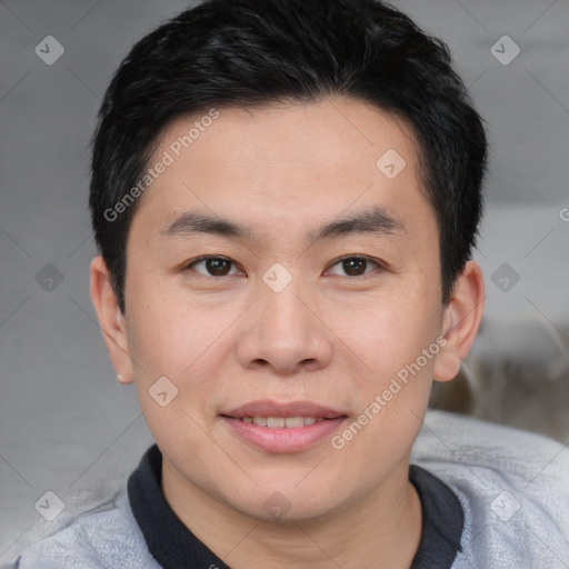 Joyful asian young-adult male with short  brown hair and brown eyes