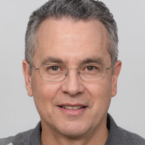 Joyful white middle-aged male with short  brown hair and brown eyes