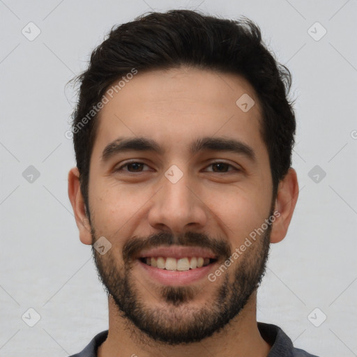 Joyful white young-adult male with short  black hair and brown eyes