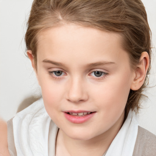 Joyful white child female with medium  brown hair and brown eyes