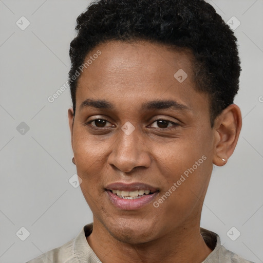 Joyful black young-adult male with short  black hair and brown eyes