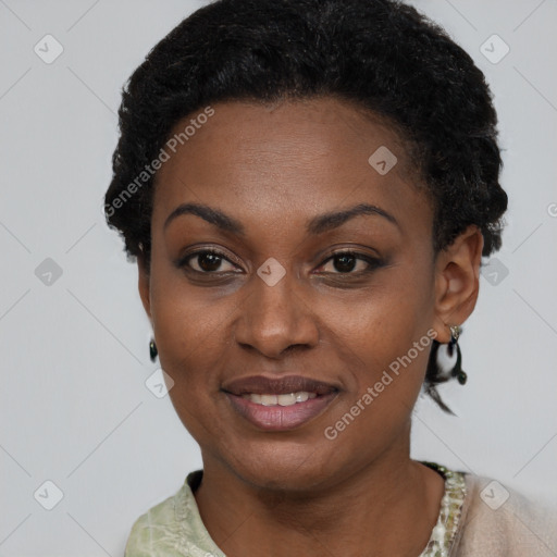 Joyful black young-adult female with short  black hair and brown eyes