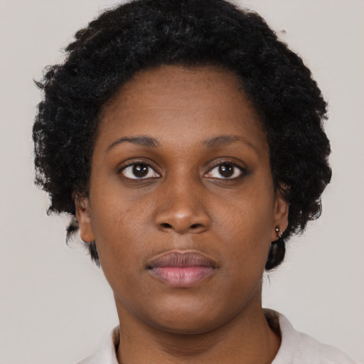 Neutral black young-adult female with short  brown hair and brown eyes