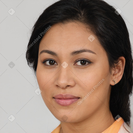 Joyful latino young-adult female with medium  brown hair and brown eyes