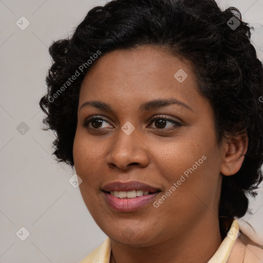 Joyful black young-adult female with long  black hair and brown eyes