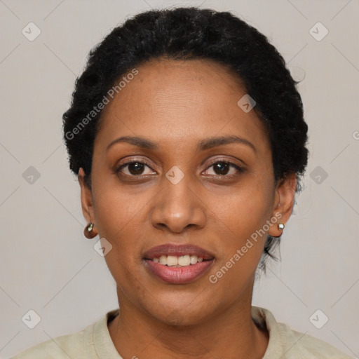 Joyful black young-adult female with short  black hair and brown eyes