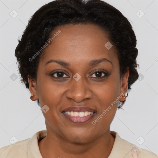 Joyful black adult female with short  brown hair and brown eyes
