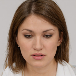 Neutral white young-adult female with medium  brown hair and brown eyes