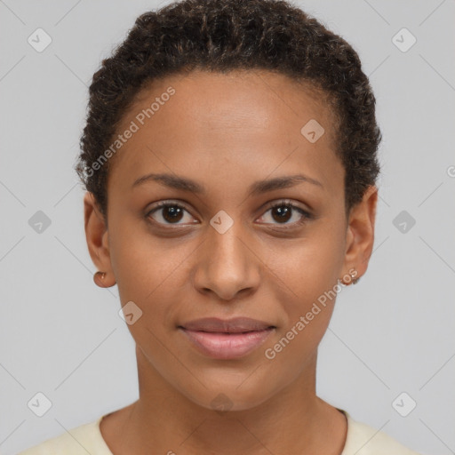 Joyful black young-adult female with short  brown hair and brown eyes