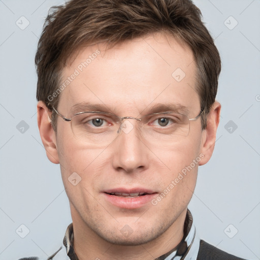 Joyful white adult male with short  brown hair and grey eyes