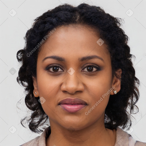 Joyful black young-adult female with long  black hair and brown eyes