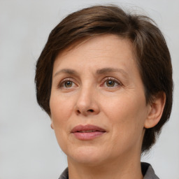 Joyful white adult female with short  brown hair and brown eyes