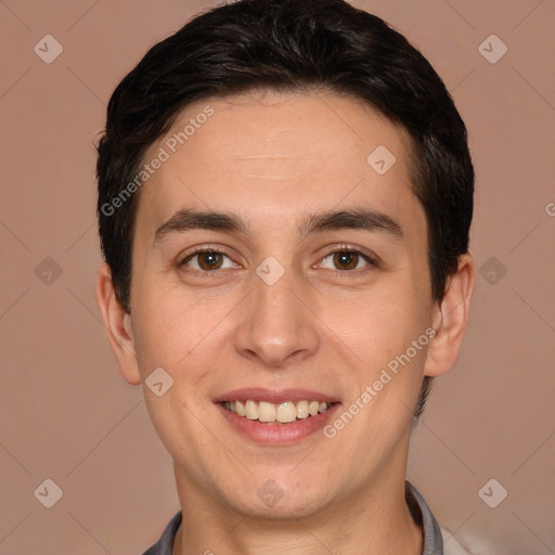 Joyful white young-adult male with short  black hair and brown eyes