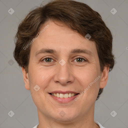 Joyful white adult female with short  brown hair and brown eyes