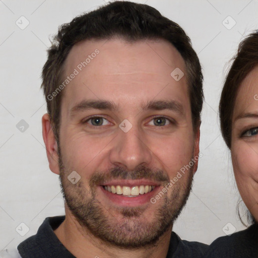 Joyful white young-adult male with short  brown hair and brown eyes