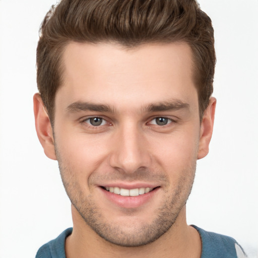 Joyful white young-adult male with short  brown hair and brown eyes