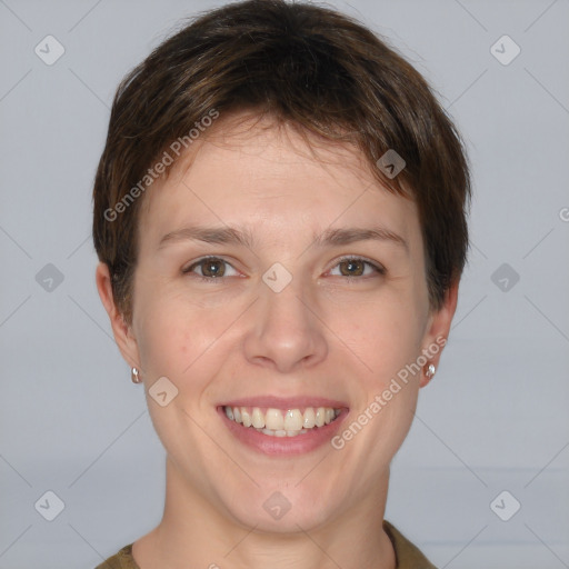 Joyful white young-adult female with short  brown hair and grey eyes