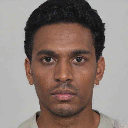 Neutral black young-adult male with short  black hair and brown eyes