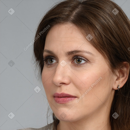 Joyful white adult female with medium  brown hair and brown eyes