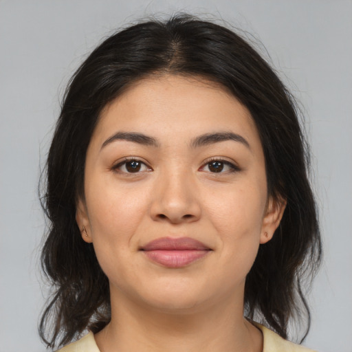Joyful asian young-adult female with medium  brown hair and brown eyes