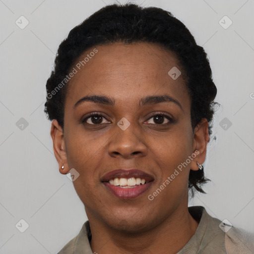 Joyful black young-adult female with short  black hair and brown eyes