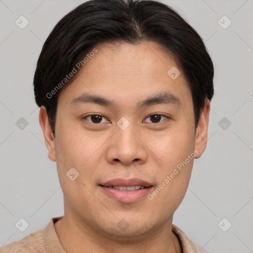 Joyful asian young-adult male with short  brown hair and brown eyes