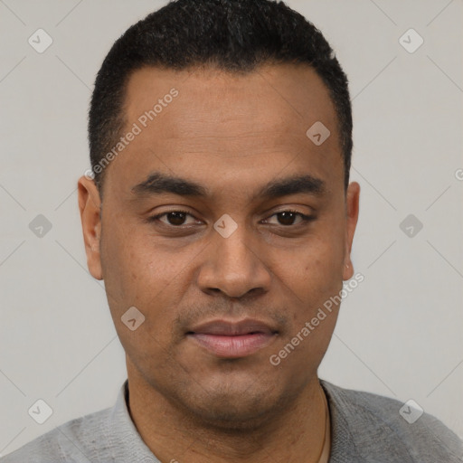 Joyful latino young-adult male with short  black hair and brown eyes