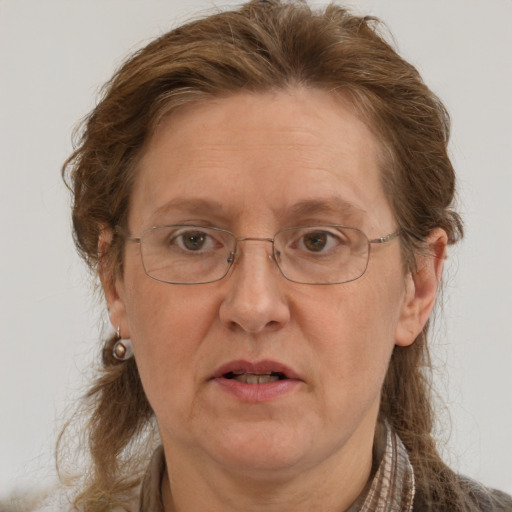 Joyful white middle-aged female with long  brown hair and grey eyes