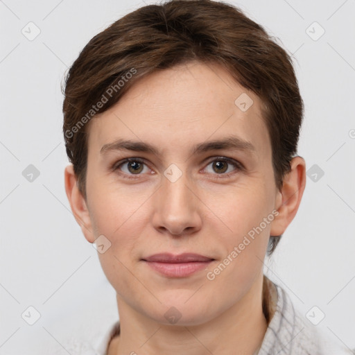 Joyful white young-adult female with short  brown hair and brown eyes