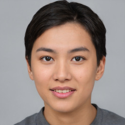 Joyful asian young-adult female with short  black hair and brown eyes