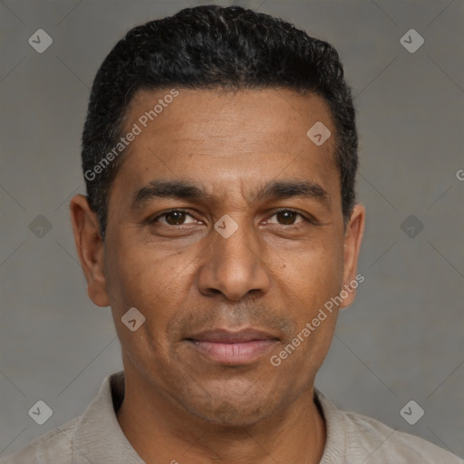Joyful black adult male with short  black hair and brown eyes