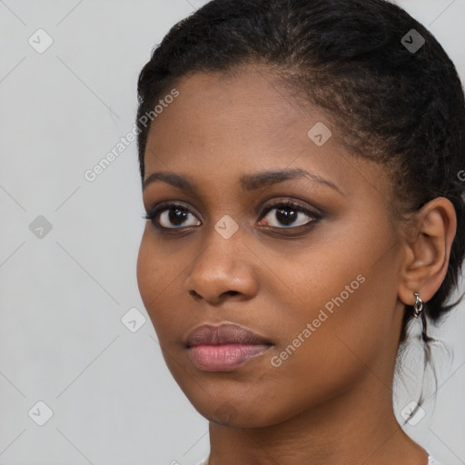 Neutral black young-adult female with short  brown hair and brown eyes