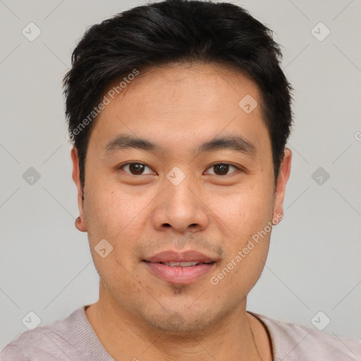 Joyful asian young-adult male with short  brown hair and brown eyes