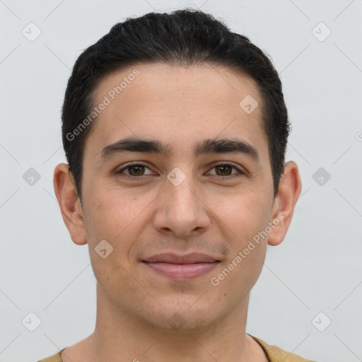 Joyful white young-adult male with short  brown hair and brown eyes