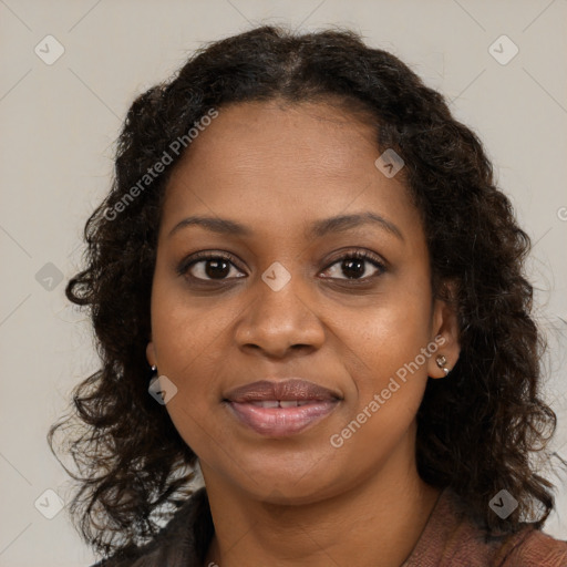 Joyful black young-adult female with long  brown hair and brown eyes