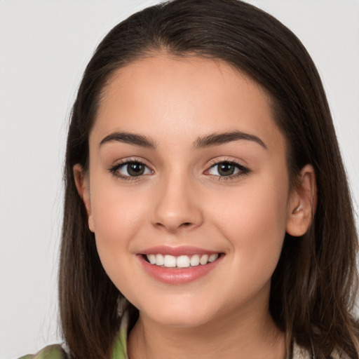 Joyful white young-adult female with long  brown hair and brown eyes