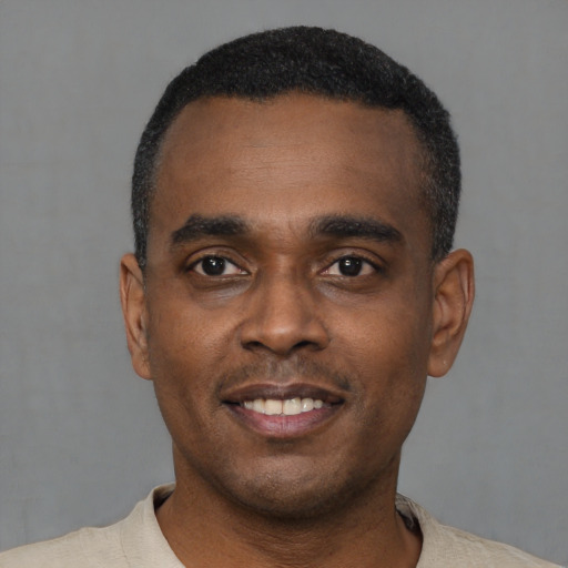 Neutral black young-adult male with short  black hair and brown eyes