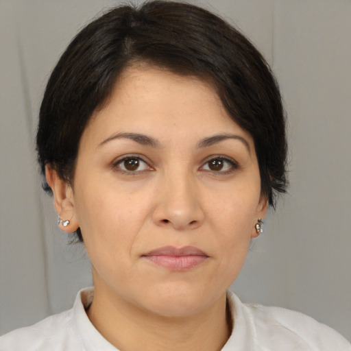 Joyful white young-adult female with medium  brown hair and brown eyes