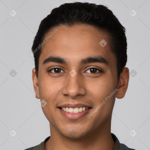 Joyful latino young-adult male with short  black hair and brown eyes