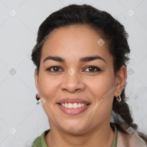 Joyful latino young-adult female with short  brown hair and brown eyes