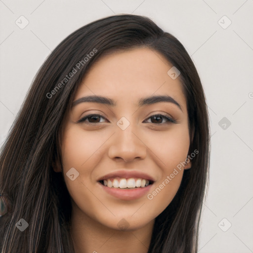 Joyful latino young-adult female with long  black hair and brown eyes