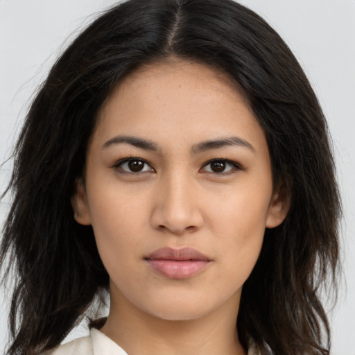 Neutral latino young-adult female with long  brown hair and brown eyes