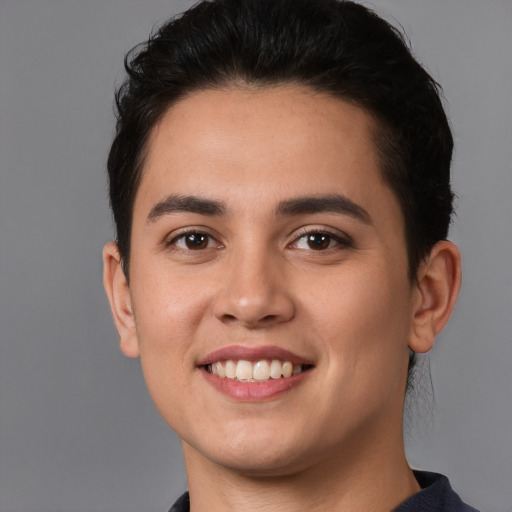 Joyful white young-adult male with short  black hair and brown eyes