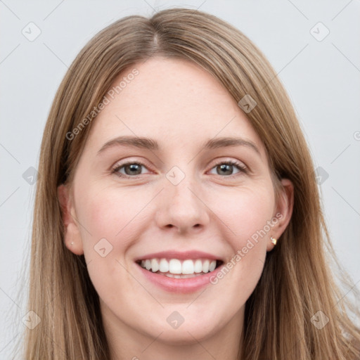 Joyful white young-adult female with long  brown hair and grey eyes