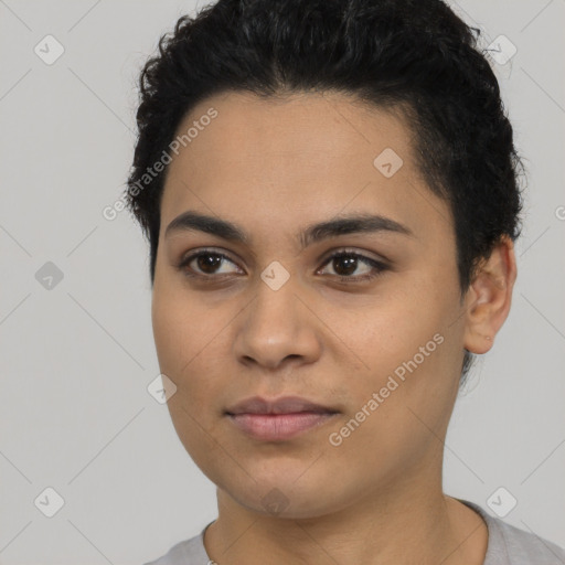 Joyful latino young-adult female with short  black hair and brown eyes