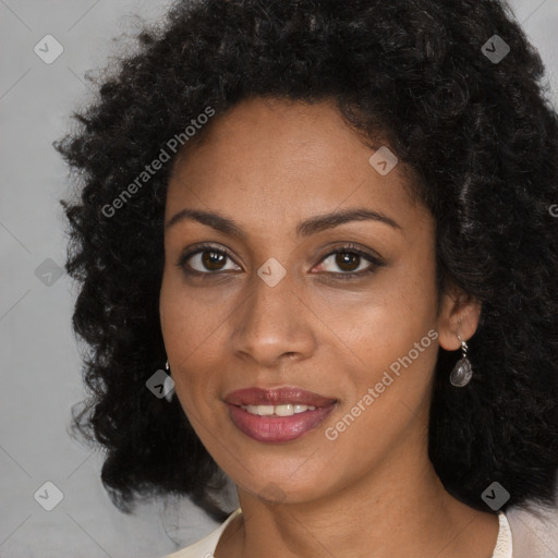 Joyful black young-adult female with long  brown hair and brown eyes