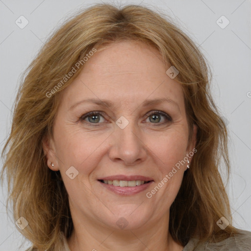 Joyful white adult female with medium  brown hair and grey eyes