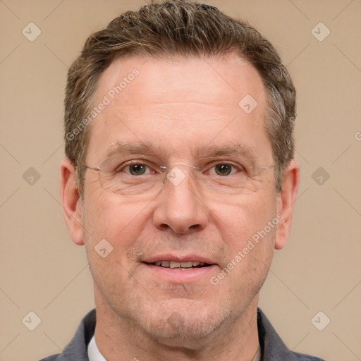 Joyful white adult male with short  brown hair and grey eyes