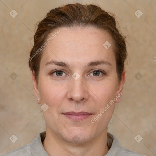 Joyful white adult female with short  brown hair and grey eyes