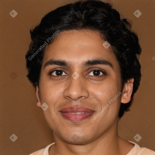 Joyful latino young-adult male with short  brown hair and brown eyes